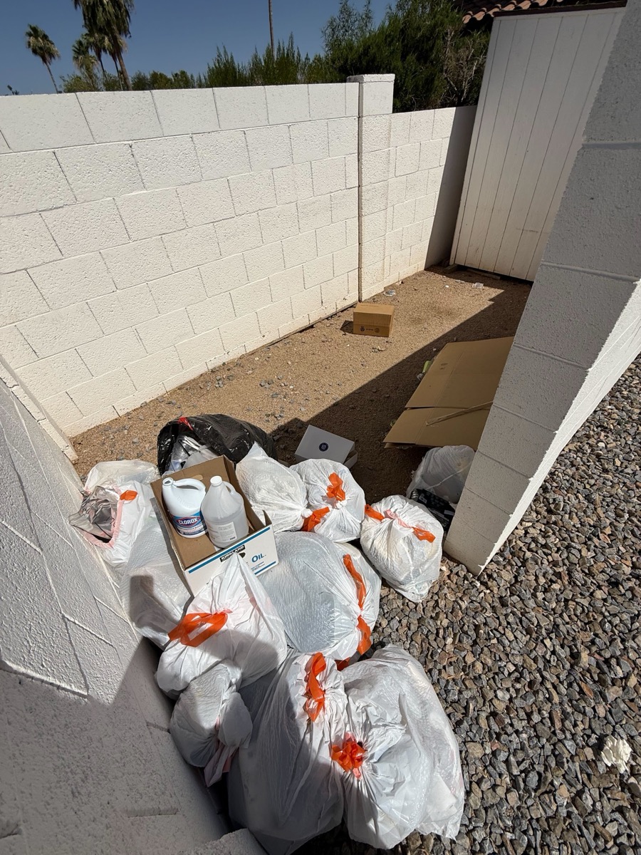 Trash pile in side yard